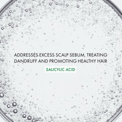 VICHY Dercos applied to scalp demonstrating targeted flake treatment
