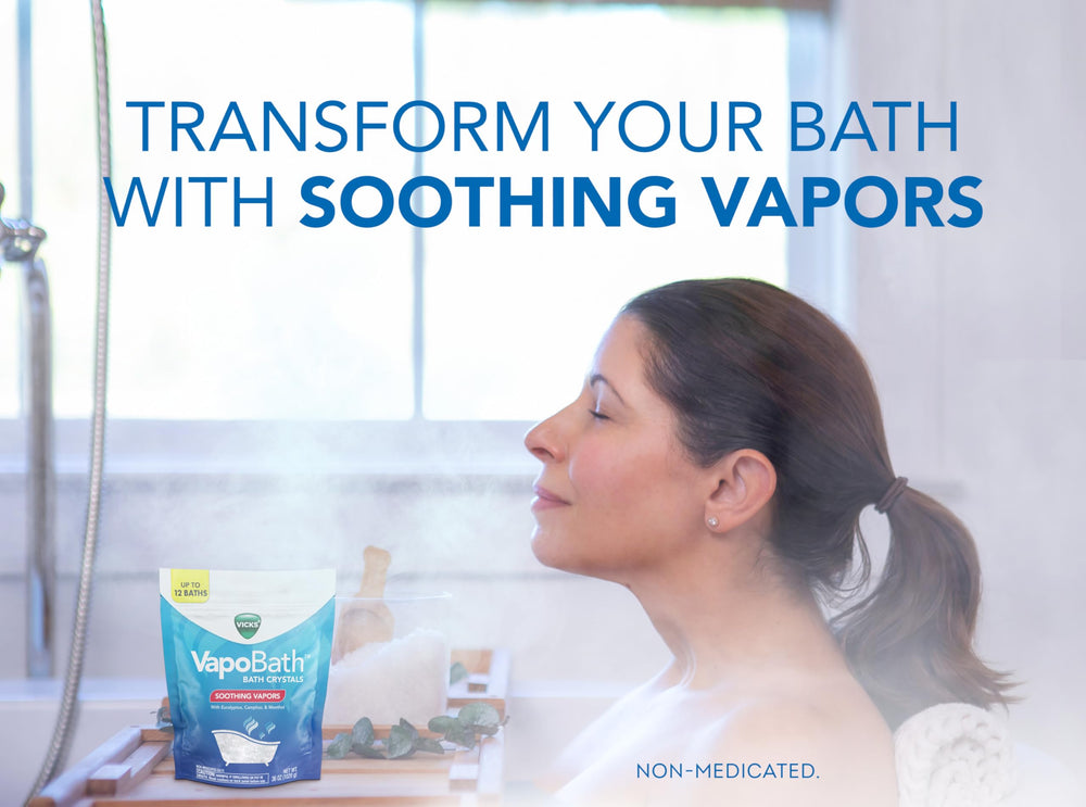 Vicks VapoBath crystals dissolving in tub, releasing comforting non-medicated vapors.