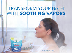 Vicks VapoBath crystals dissolving in tub, releasing comforting non-medicated vapors.