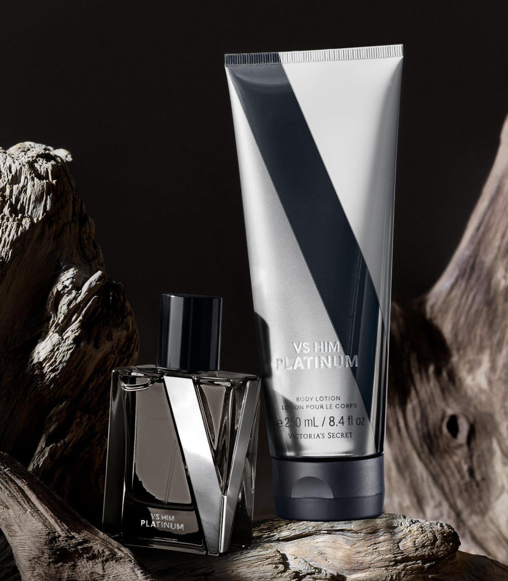 Victoria's Secret VS Him Platinum cologne bottle beside lotion for layering