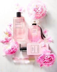 Victoria's Secret Bombshell Mini notes image hints mood-boosting fruity floral scent.