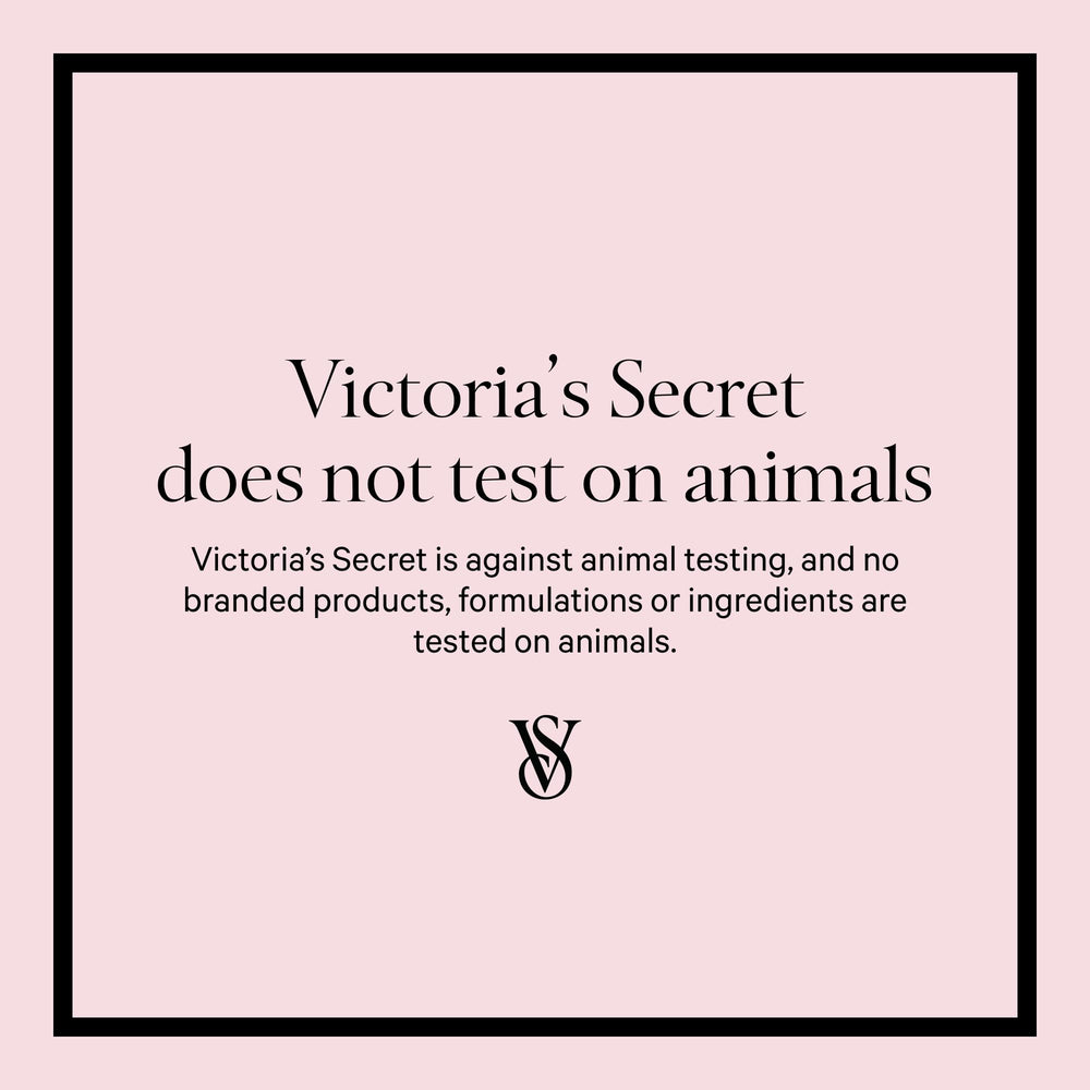 Victoria's Secret Love Spell bottle in hand, cherry blossom and peach vibe.