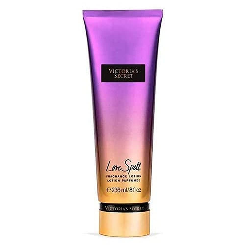 Victoria's Secret Love Spell fragrance lotion bottle reveals cherry blossom and peach scent with long-lasting hydration.