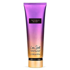 Victoria's Secret Love Spell fragrance lotion bottle reveals cherry blossom and peach scent with long-lasting hydration.