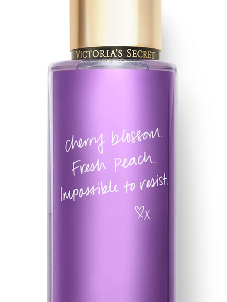 Victoria's Secret Love Spell fragrance label highlights cherry blossom and peach hints.