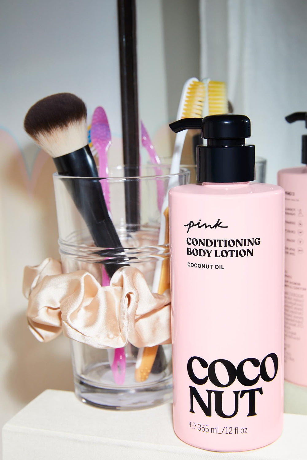 Victoria's Secret Pink Coco Hydrating Coconut Oil ingredient feature for rich skin-softening.
