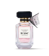Victoria's Secret Tease EDP on skin swatch shows floral-pear balance.