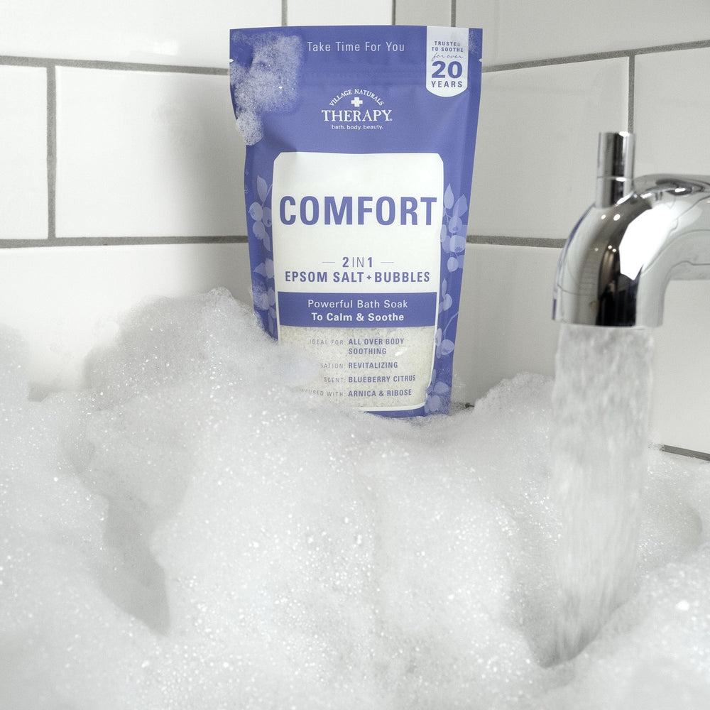 Village Naturals Therapy Comfort Foaming Bath Soak label detail signals USA-made quality and care.