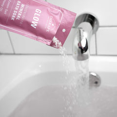 Village Naturals Therapy Glow cap close-up reveals Epsom salt blend for calming baths