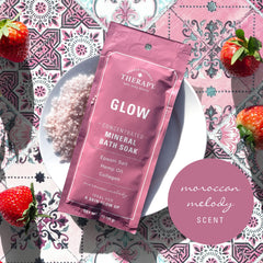 Village Naturals Therapy Glow bath soak pour close-up for aromatic stress-relief ritual
