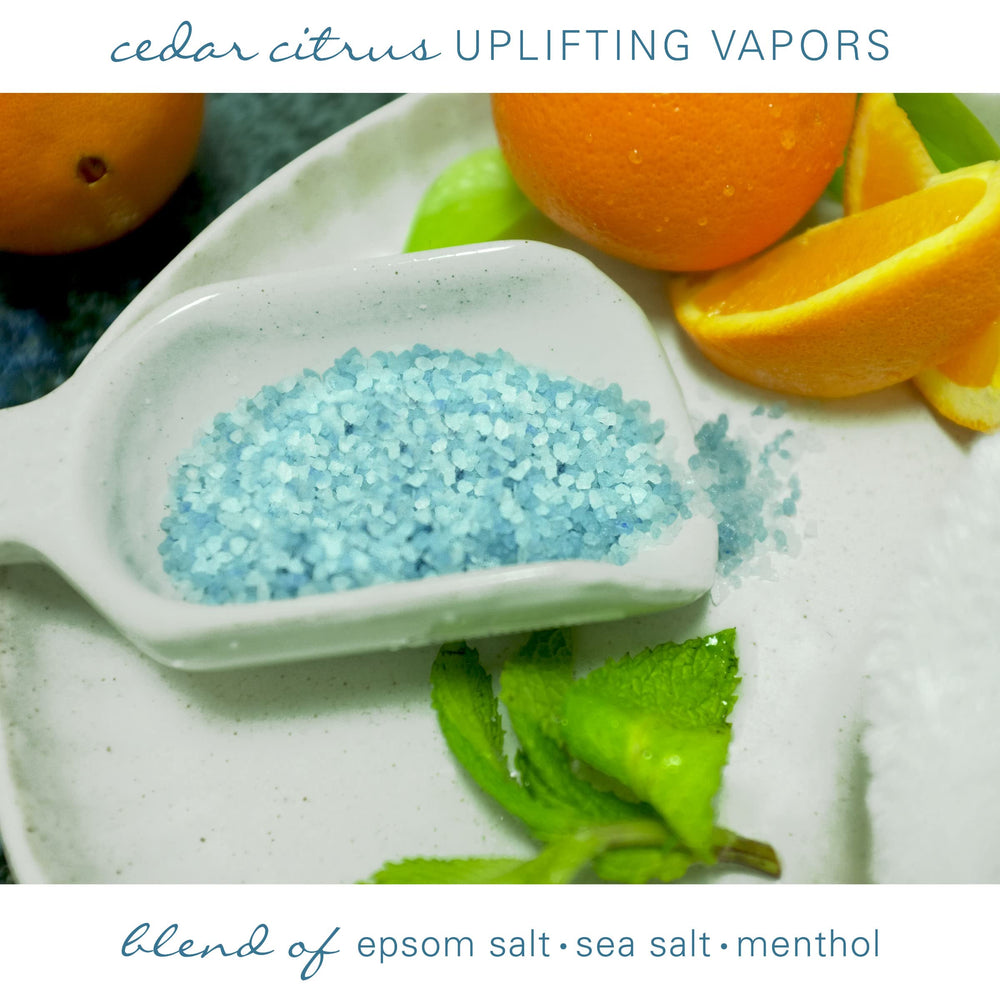 Village Naturals Therapy Tension Bath Soak cap dispenser highlights easy two-capful dosing