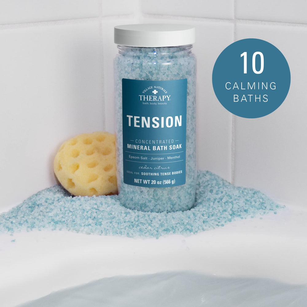 Village Naturals Therapy Tension Bath Soak Sea Salt dissolving in water for a cleansing soak