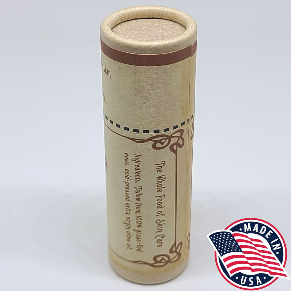 Vintage Tradition lip balm being applied to lips for conditioning moisture