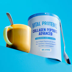 Vital Proteins open jar with spoonful of powder for easy scooping