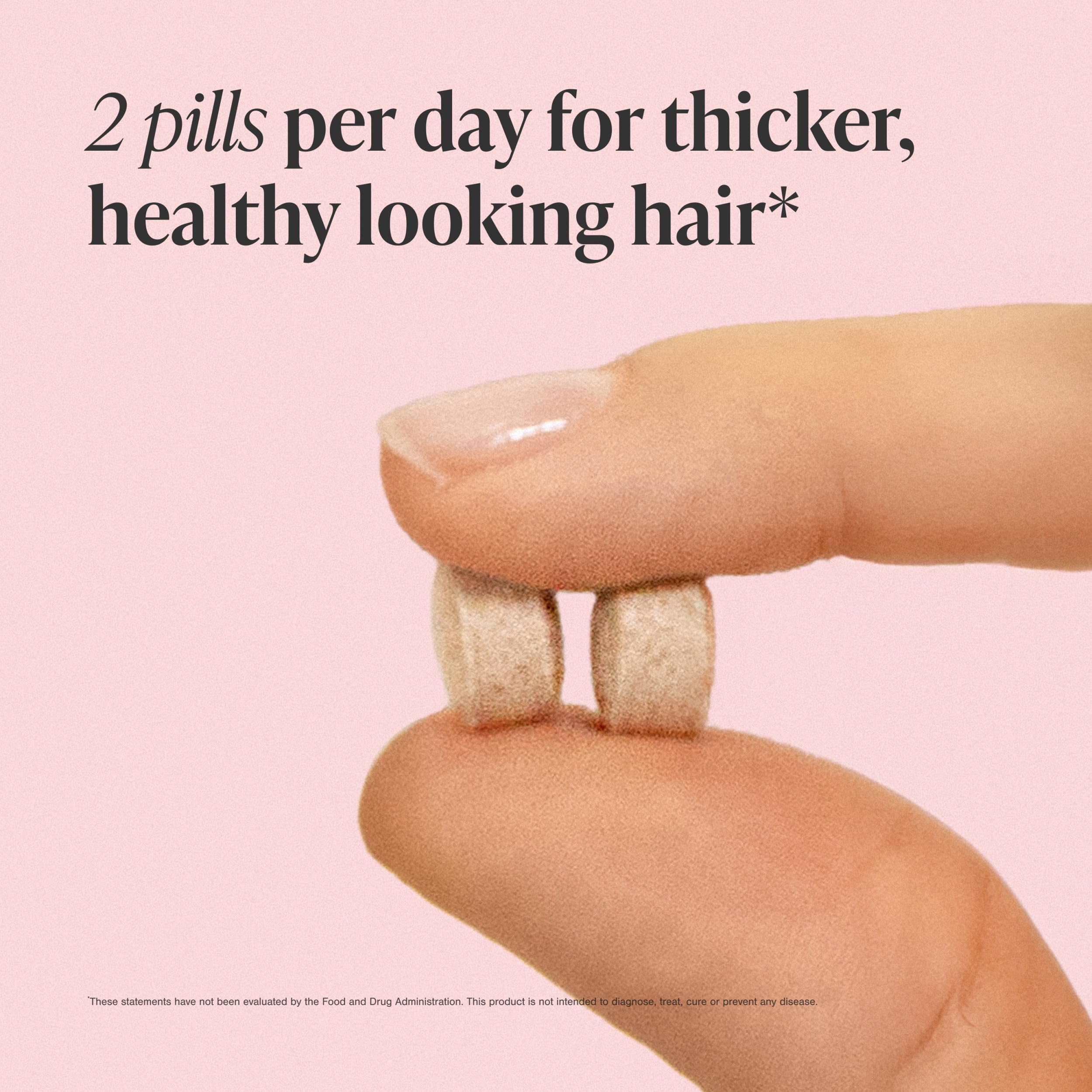 viviscal tablets in hand for size comparison and convenient daily use benefit