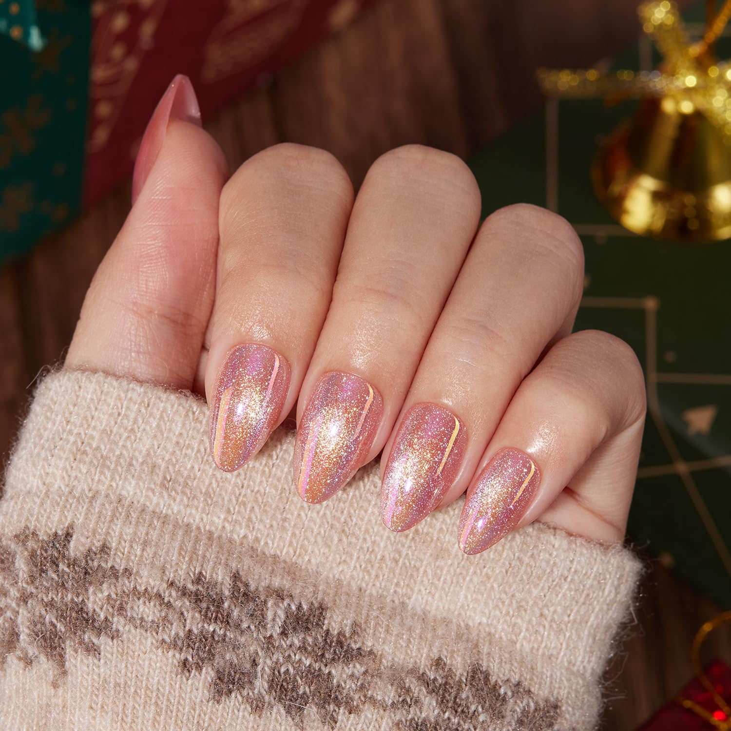 Close-up of VSALON pink cat-eye nails showing shimmer and shine
