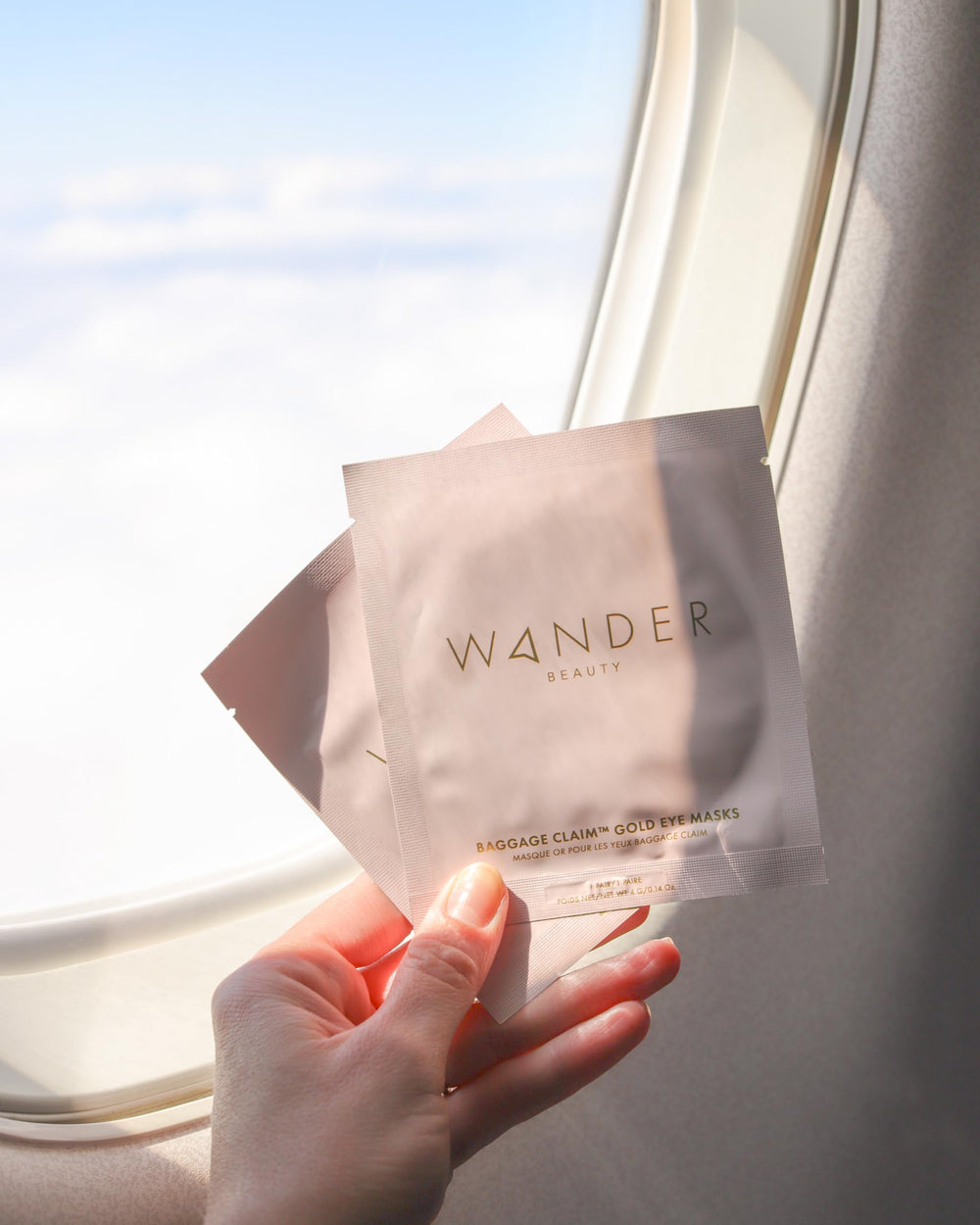 Wander Beauty Baggage Claim rose-gold patches under eyes for brightening.