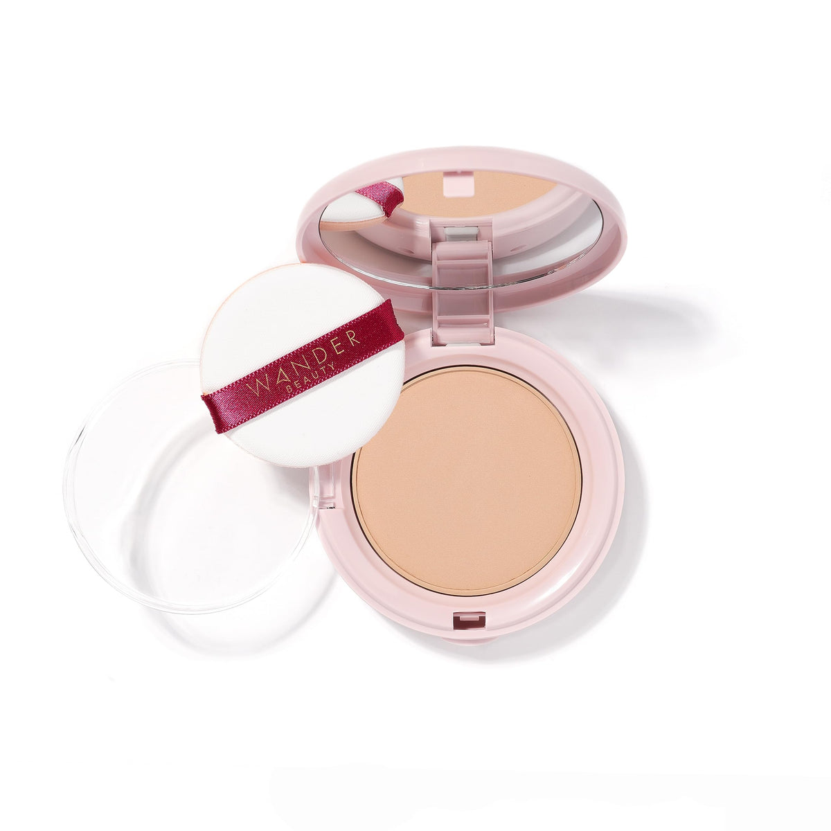 Wander Beauty Wanderlust Powder Foundation Medium compact open for easy on-the-go touch-ups.