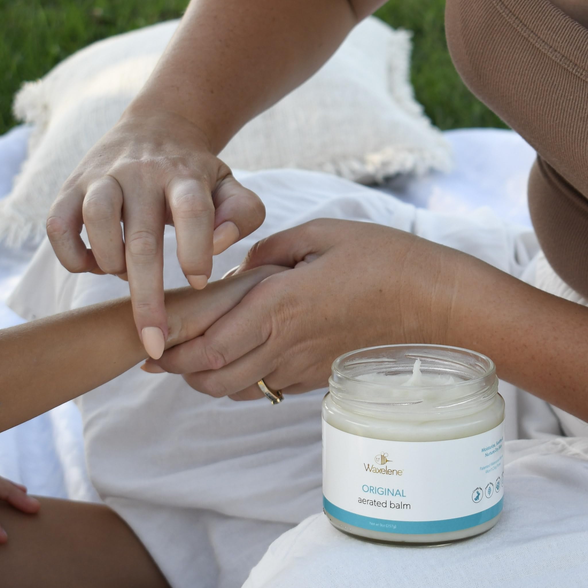 Waxelene Original Aerated Balm texture close-up highlighting silky breathable barrier.