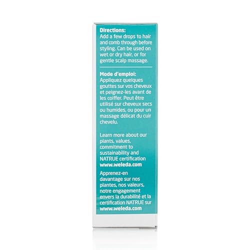 Weleda Rosemary Conditioning Hair Oil on hair strands for smooth, manageable style.