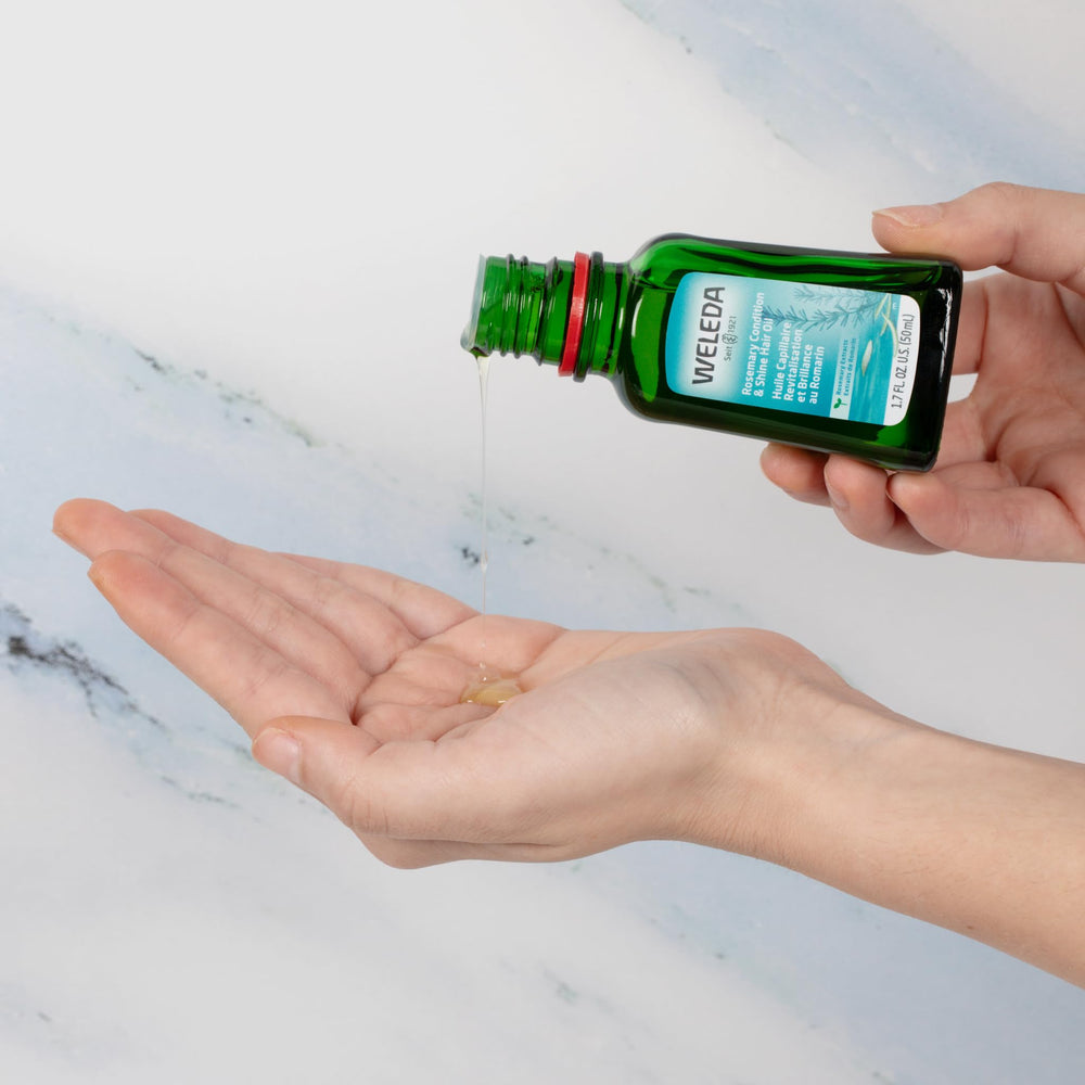 Weleda Rosemary Conditioning Oil on damp hair ready for styling.