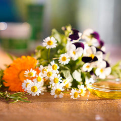 Weleda Skin Food Intensive Body Butter texture being spread for fast hydration.