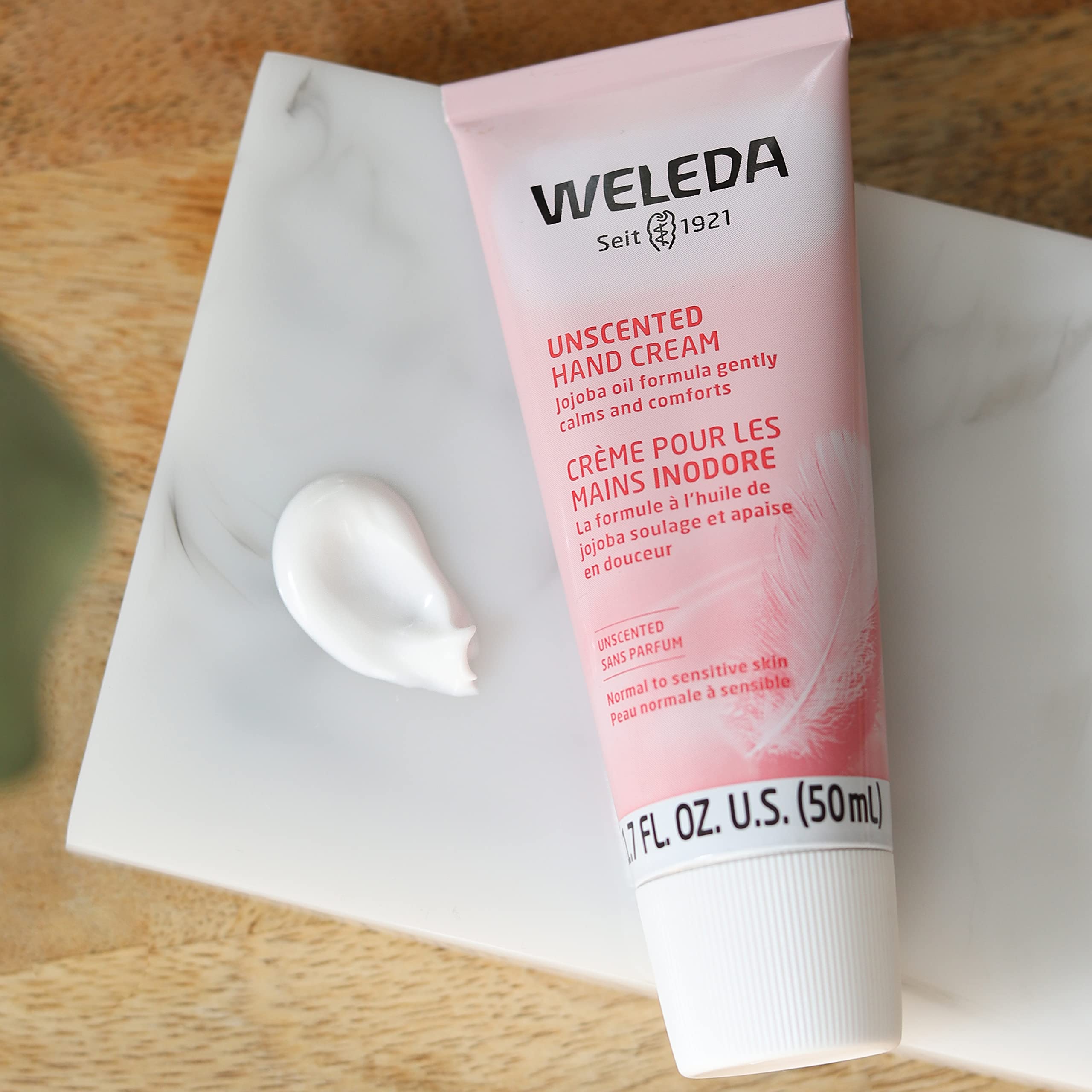 Weleda Unscented Hand Cream ready to use for daily moisturization.
