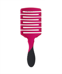 Wet Brush Brush Pro Flex Dry Paddle Pink in hand highlighting flexible styling on damp hair