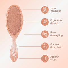 Wet Brush Original Detangler Pink bristles detangle damp hair smoothly for gentle styling.