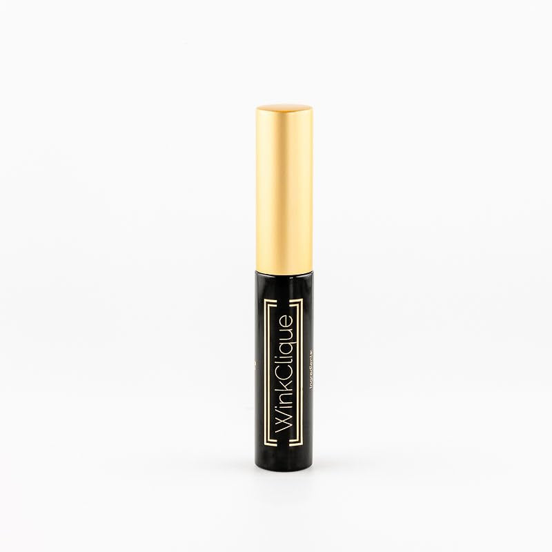 WINKCLIQUE eyelash adhesive bottle closeup showing strong hold and sleek black formula.