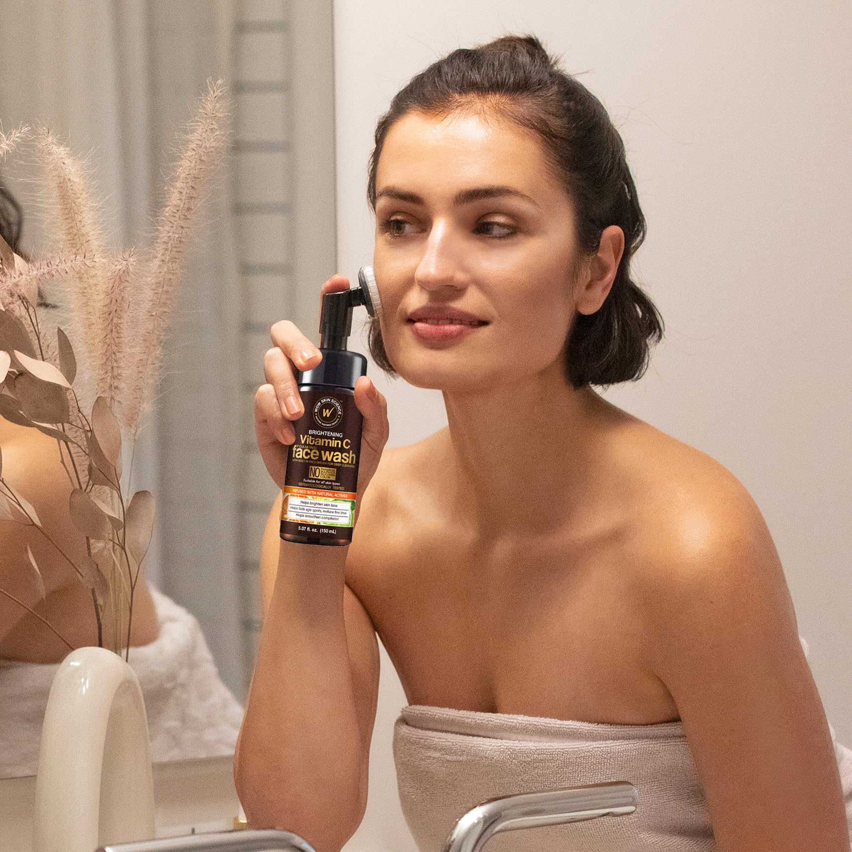 WOW Skin Science Vitamin C Face Wash & Brush on sink with foam, suggesting easy cleansing.