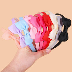 XIMA bow headbands ribbon close-up highlights soft grosgrain texture for gentle wear.