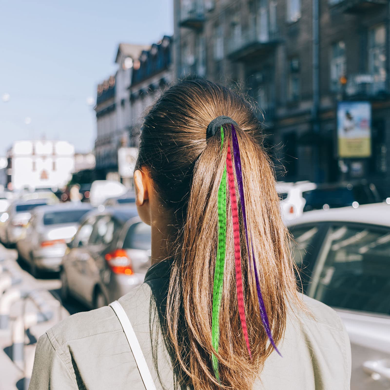 Xinnun model wearing colorful feathers demonstrates cosplay and party-ready look.
