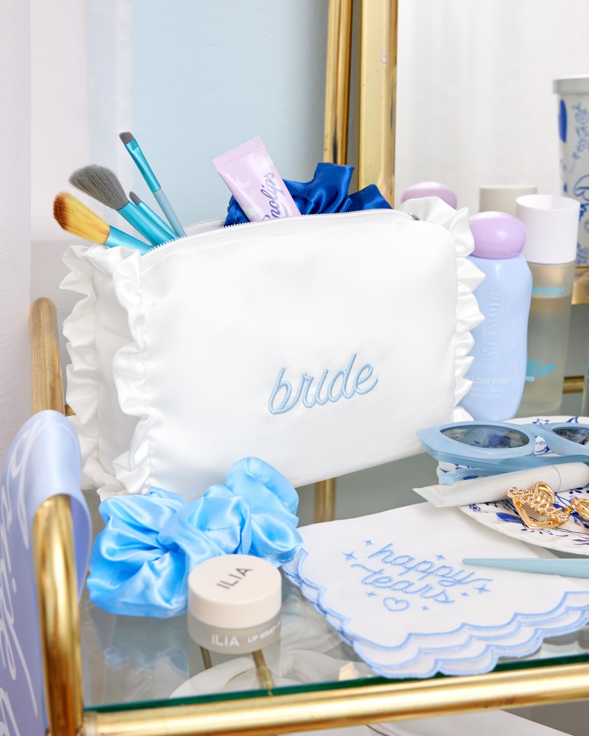 xo, Fetti blue embroidery bride detail—vibrant accent for wedding day prep.