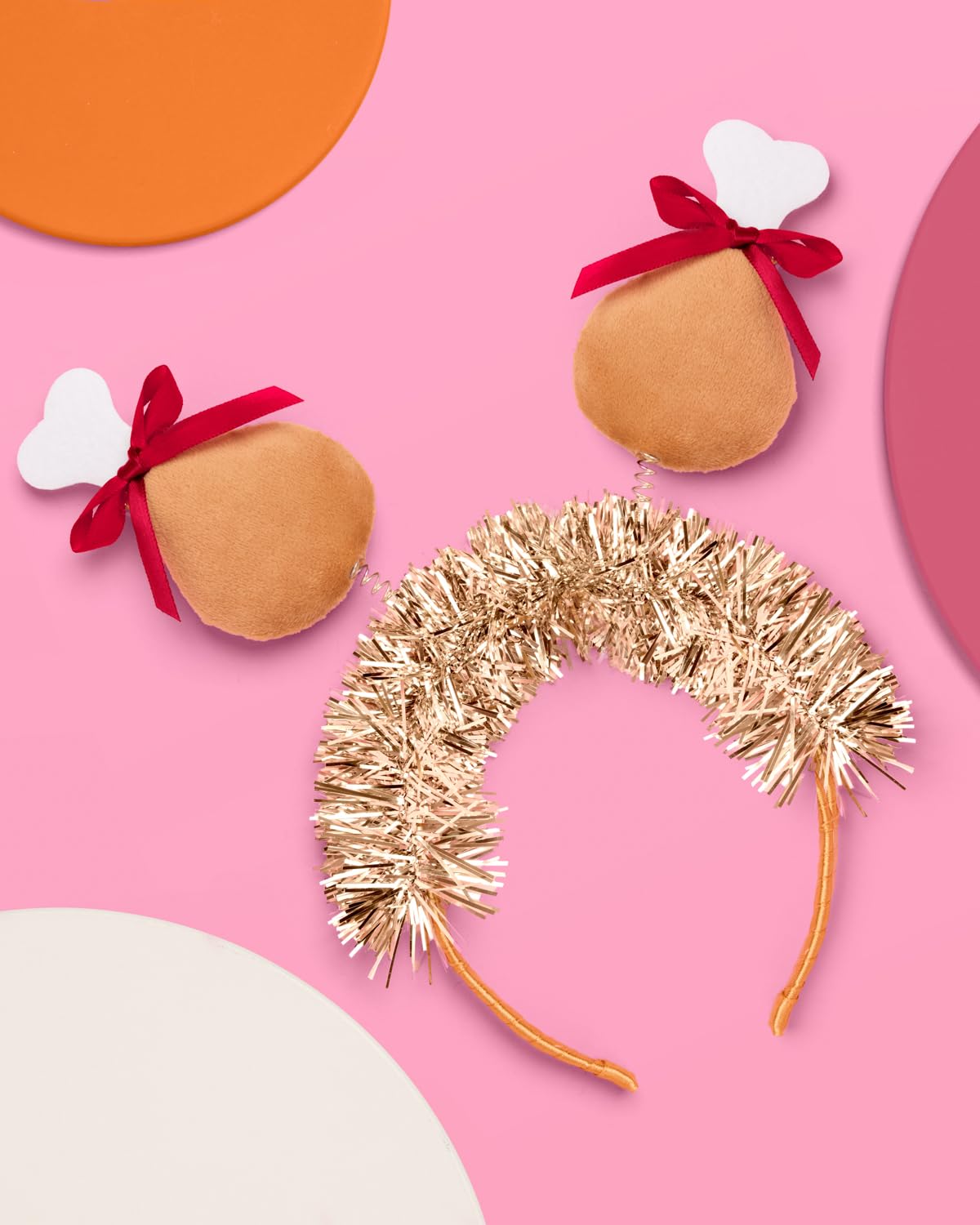 xo, Fetti turkey legs detail on headband highlight plush legs for playful holiday flair.