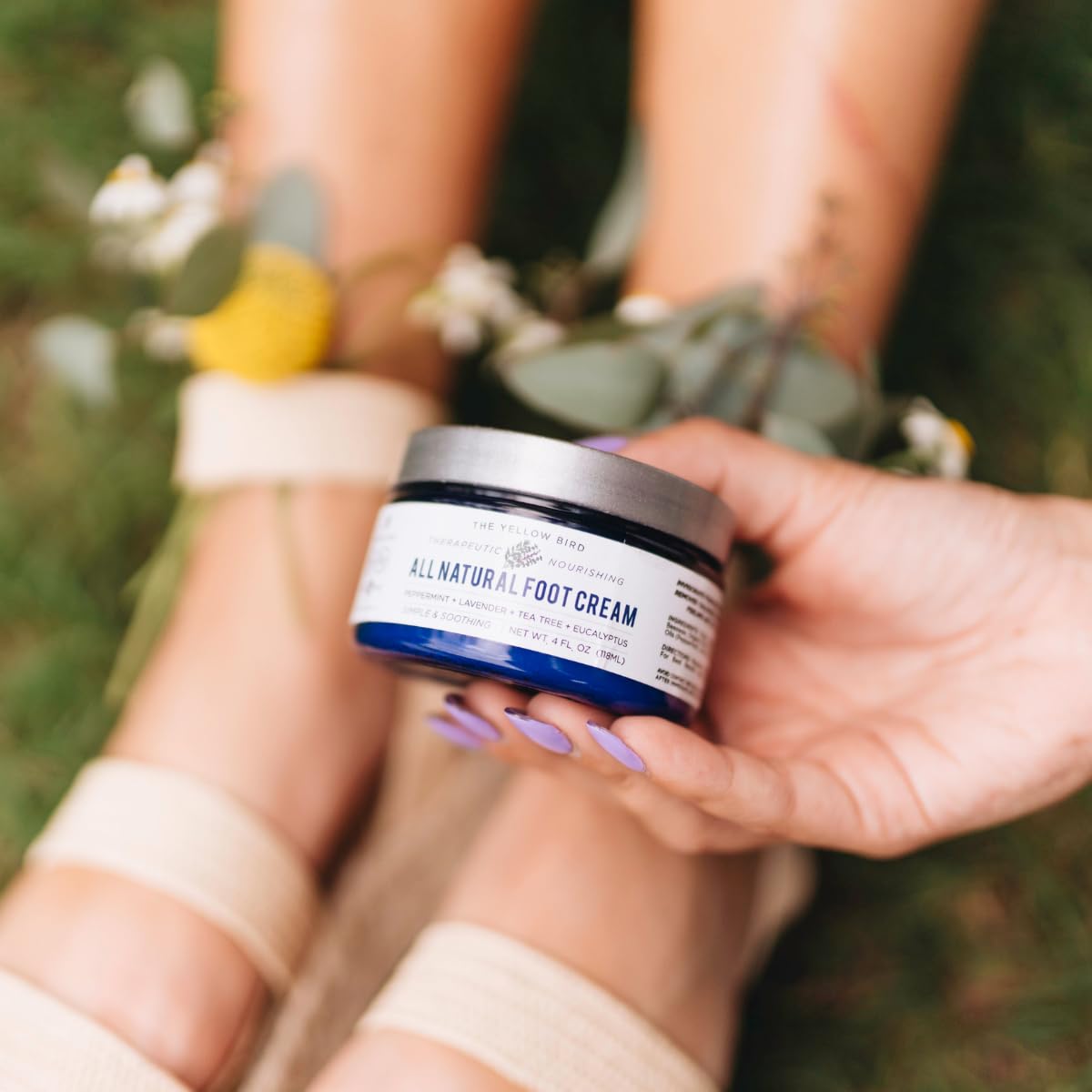 Yellow Bird cream texture closeup shows concentrated, balm-like formula for lasting relief.