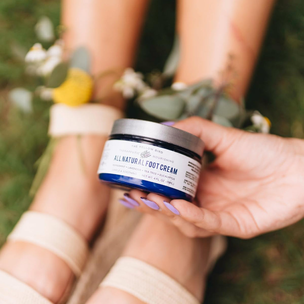 Yellow Bird cream texture closeup shows concentrated, balm-like formula for lasting relief.