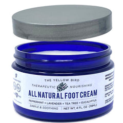 The Yellow Bird Tea Tree Foot Cream bottle highlighting natural hydration for dry feet.