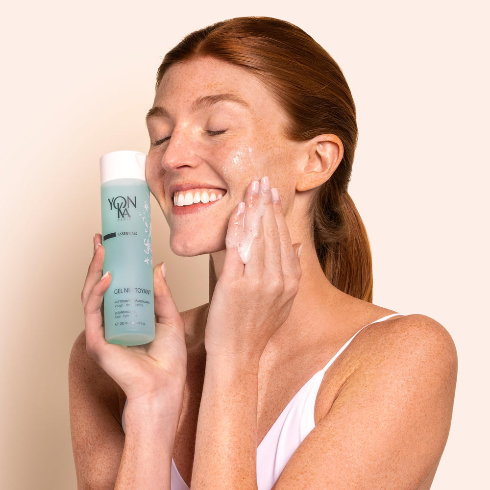 Yon-Ka Gel Cleanser removing makeup with a damp cotton ball.