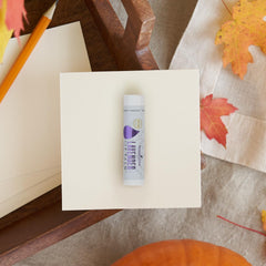 Young Living Lavender Lip Balm closeup shows creamy texture and soothing glow.