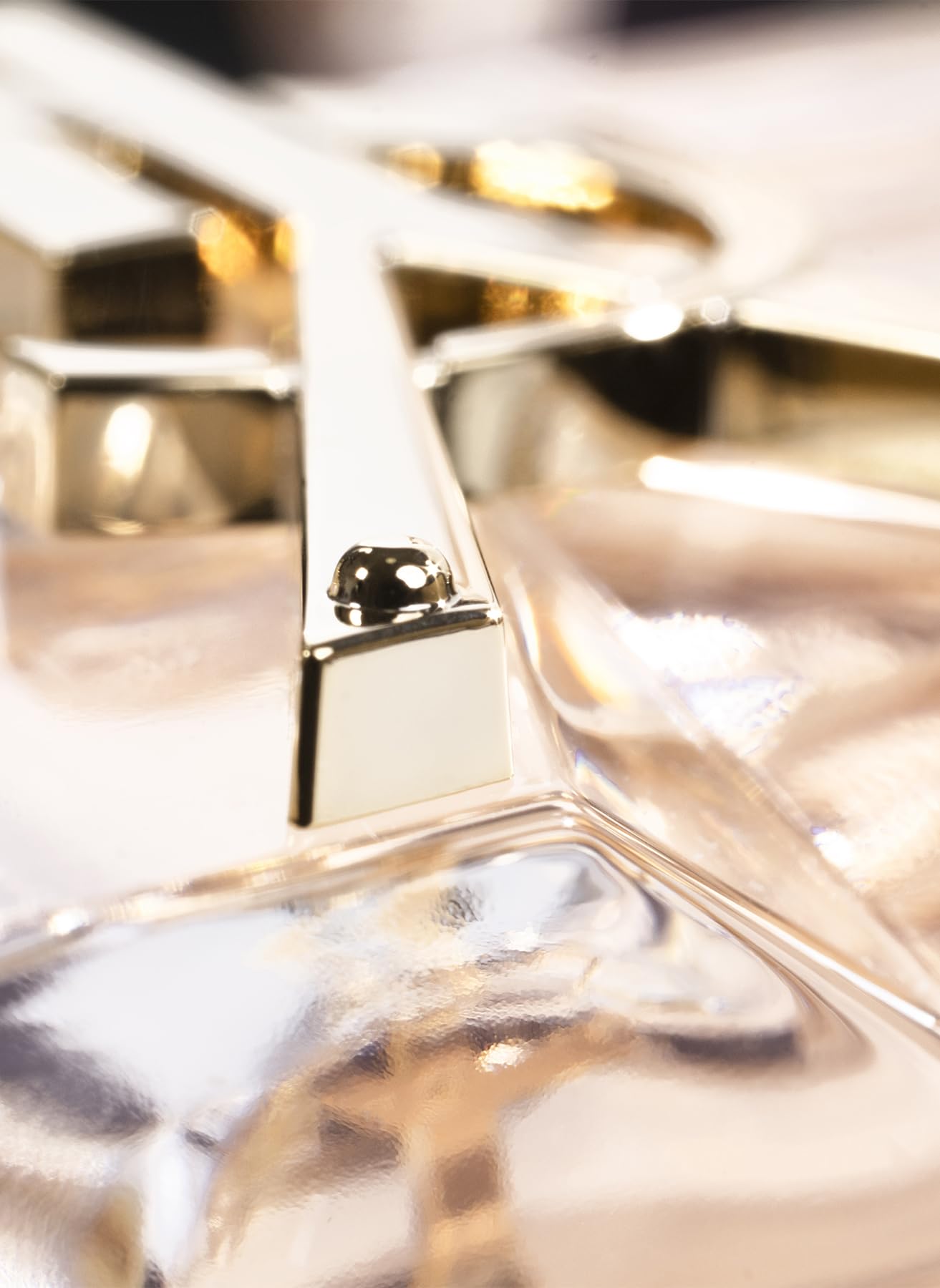 Yves Saint Laurent Libre cap closeup highlights refined branding and durable design, for travel-ready fragrance.