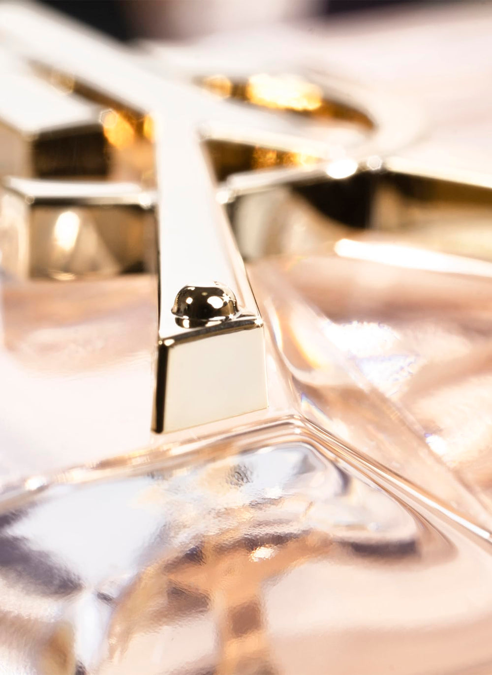 Yves Saint Laurent Libre cap closeup highlights refined branding and durable design, for travel-ready fragrance.