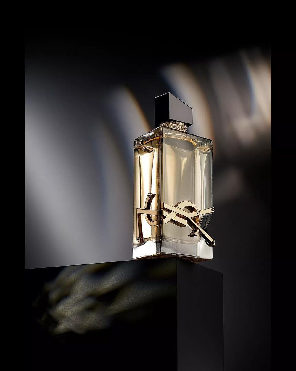 YSL Libre eau de parfum bottle with logo wrap signals couture style for day-to-night wear.