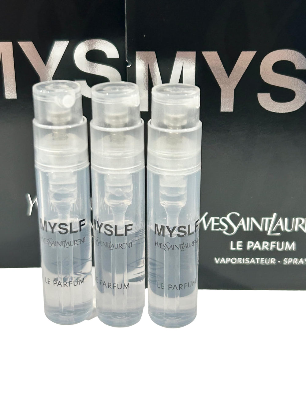 YSL Myslf Le Parfum triple-vial collection for fragrance sampling.