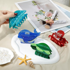Yussti sea animals octopus clip secures half-up styles with shimmering detail.