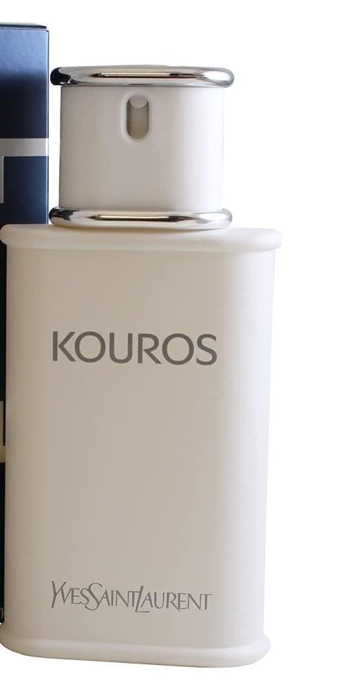 Kouros fragrance close-up showing amber-hued warmth and depth.