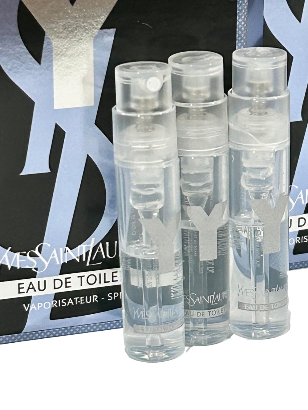 YSL Y Men sample EDT set display showing three partial vials for testing and comparison.
