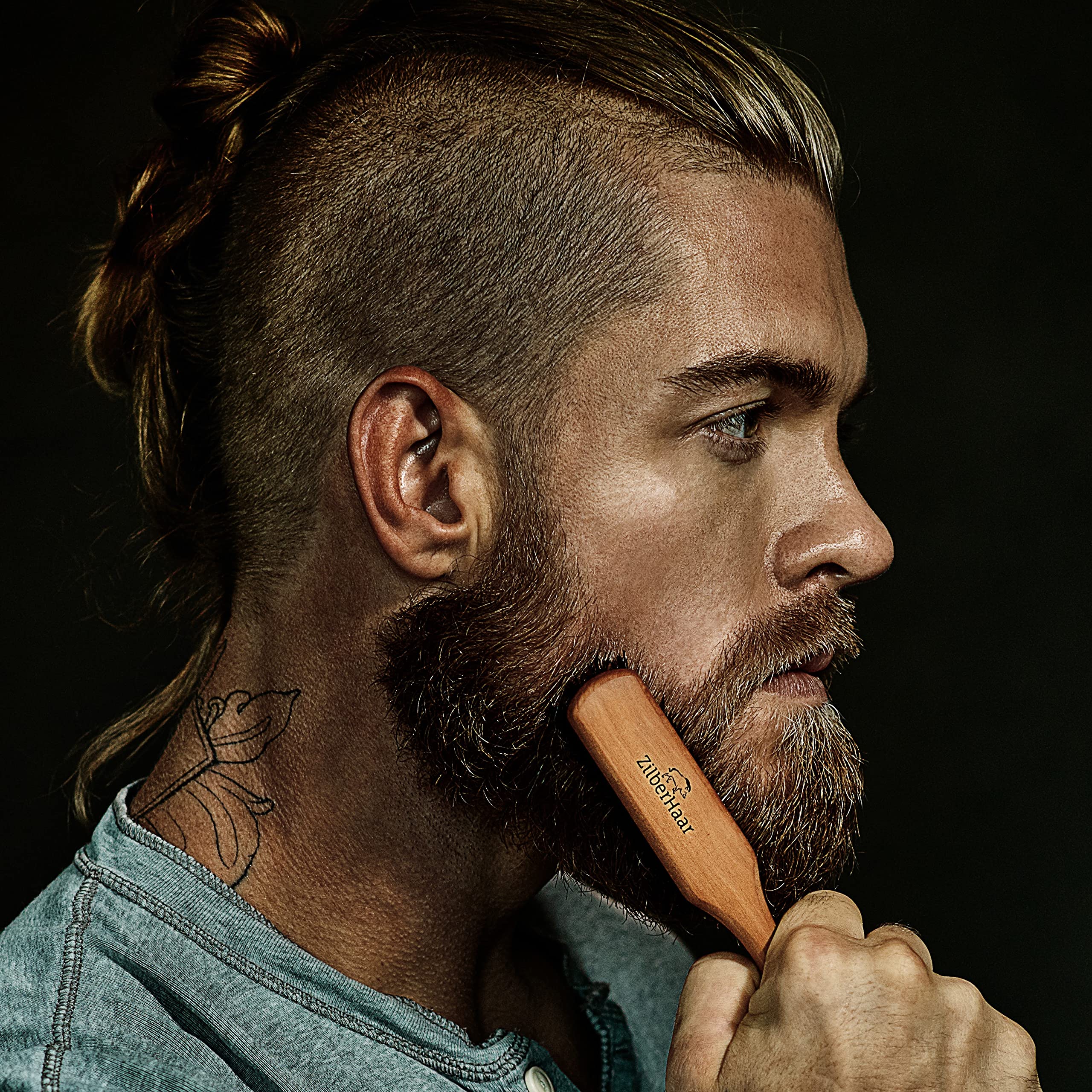ZilberHaar beard brush in use by a gentleman for precise beard straightening.
