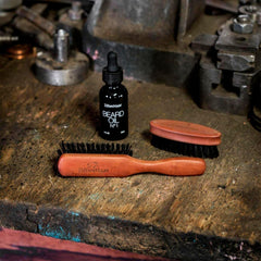 ZilberHaar beard brush shown with beard oil and balm for grooming routine.
