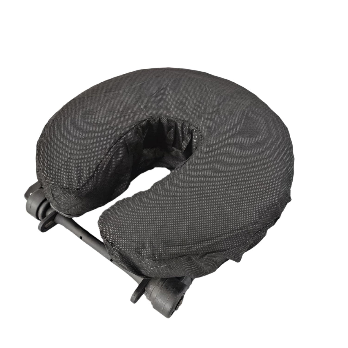 ZMDREAM disposable headrest cover folded for quick hygienic setup on a massage table.